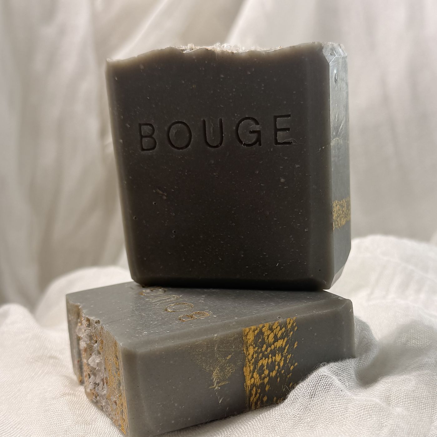 BOUGE Atelier No.07 soap, slate grey bar stacked on a grey bar with gold detail